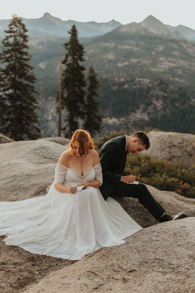 couple writing vows for elopement