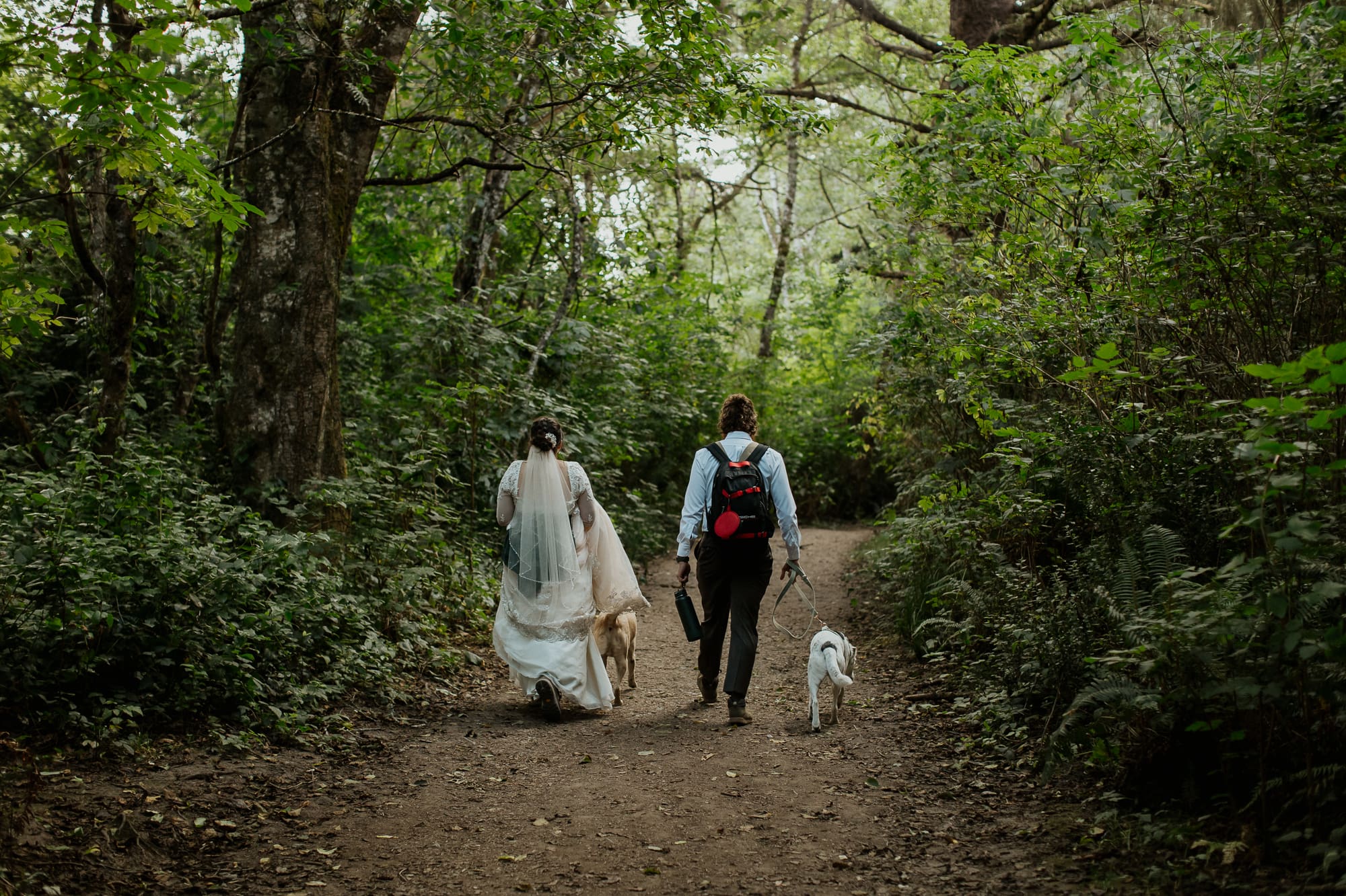 couple hiking to their elopement location